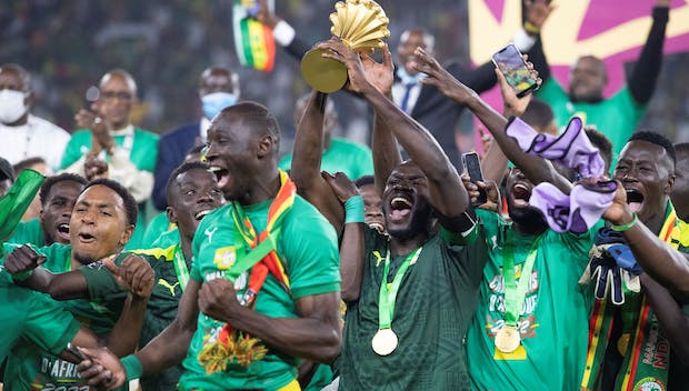 Senegal celebrate winning 2021 Africa Cup of Nations against Egypt in Yaounde on February 6, 2022 (Photo by