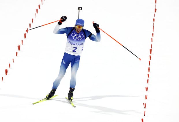 Quentin Fillon Maillet of Team France celebrates winning the Men's Biathlon Pursuit at the 2022 Winter Olympic Games (Christophe Pallot/Agence Zoom/Getty Images)
